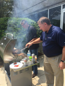 Kent and John firing up the grill for another “practice” session for the annual cookout